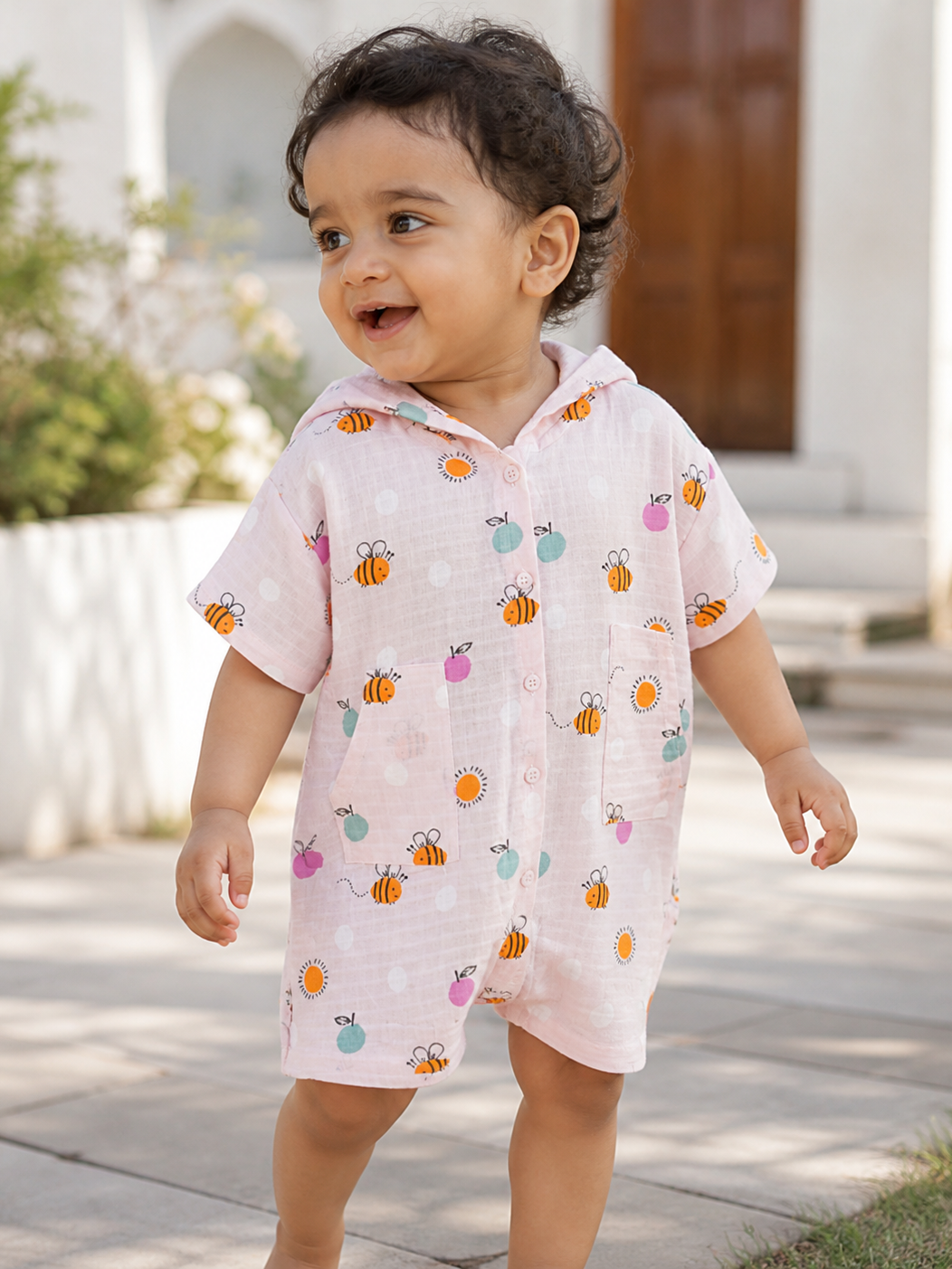 Baby wearing Hopebow bee print romper with matching hood