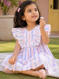 Girl wearing Hopebow pastel stripe lace dress