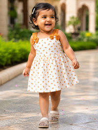 Baby girl wearing Hopebow Aarohi leaf print frock