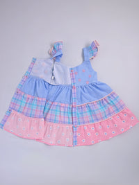 Hopebow Pastel Bloom tiered cotton baby girl frock with coordinating bucket hat, styled flat lay