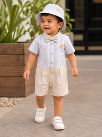 Baby boy wearing Hopebow pastel blue striped shirt with beige shorts and hat