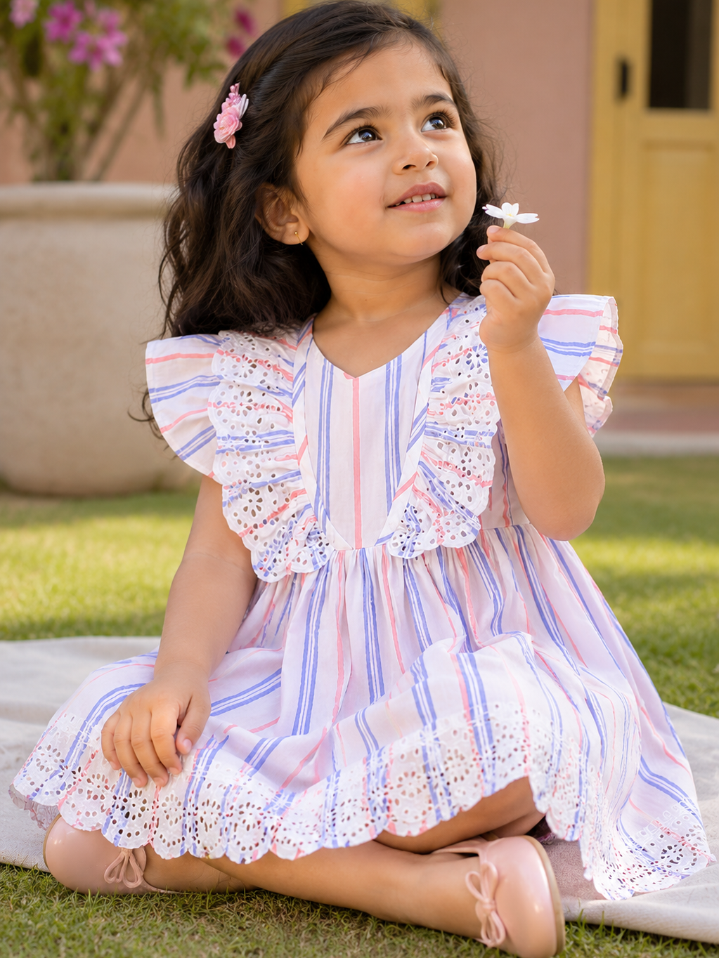Girl wearing Hopebow pastel stripe lace dress