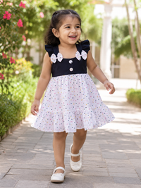 Toddler girl wearing Hopebow Noir Bow contrast frock