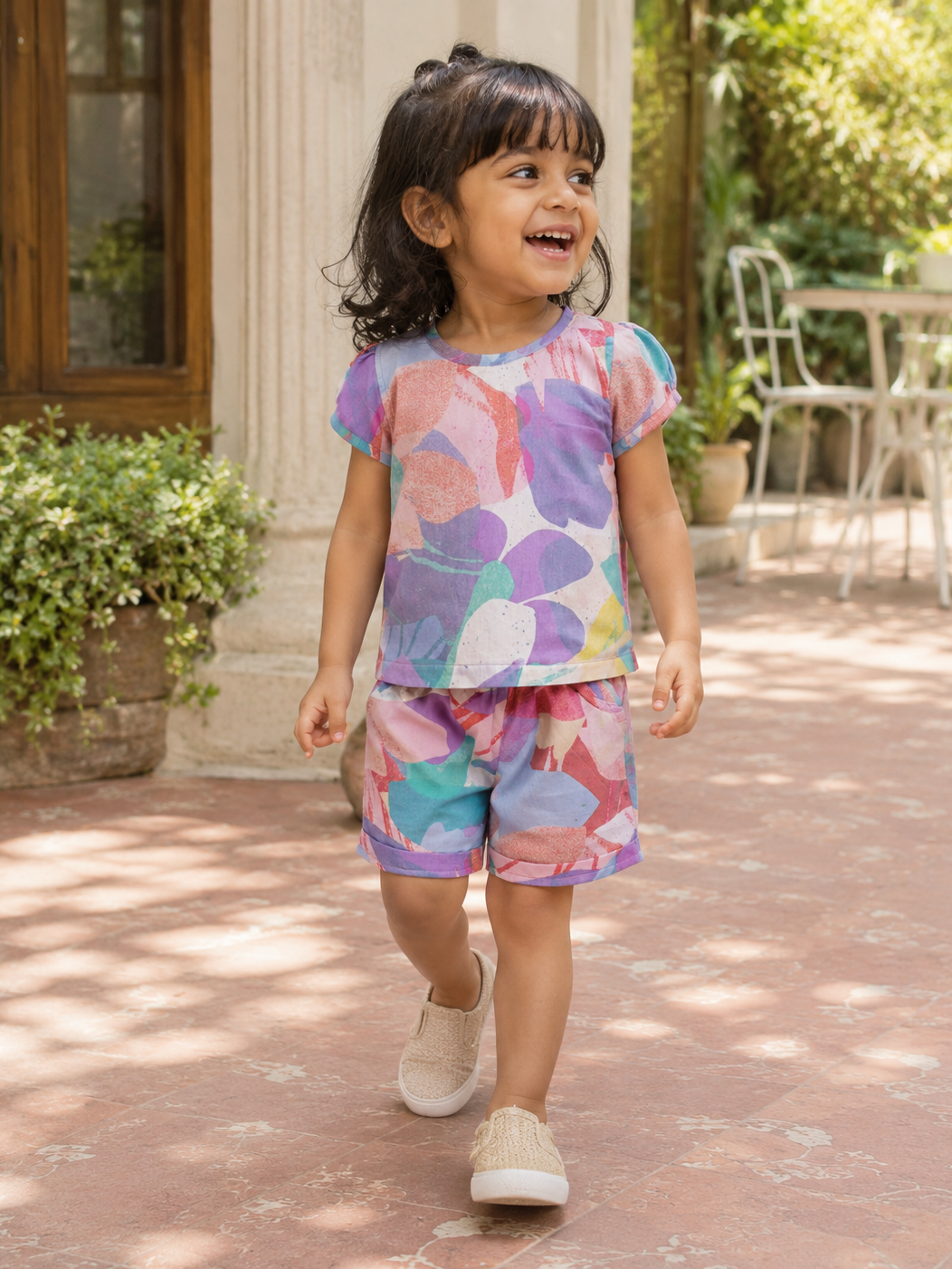 Girl wearing Hopebow pastel abstract print co-ord set