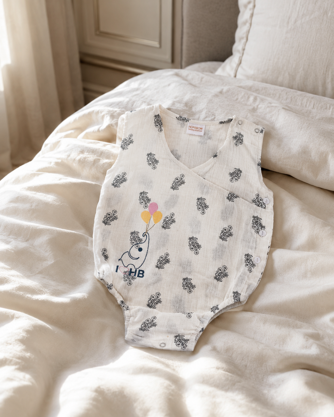 Premium white baby romper with black floral print